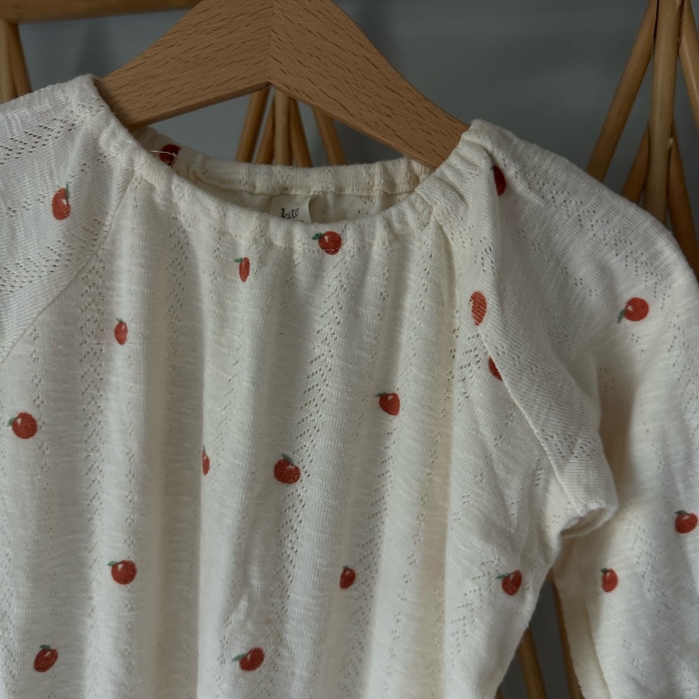 Kate Quinn Cream one piece with oranges